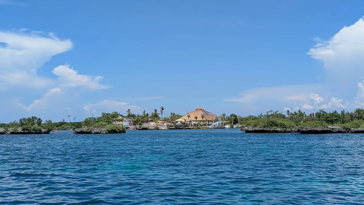 Nalusuan island's resort on stilts across clear blue water