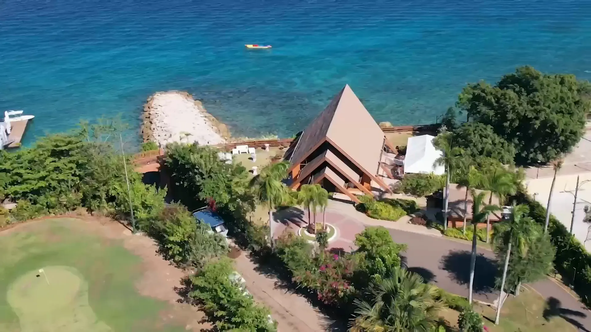 The Ocean Pavilion at Shangri-La Mactan from above, with the breakwater and turquoise sea